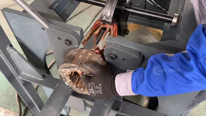 Workers Operating a Stator Coil Removal Machine Workers Operating a Stator Coil Removal Machine